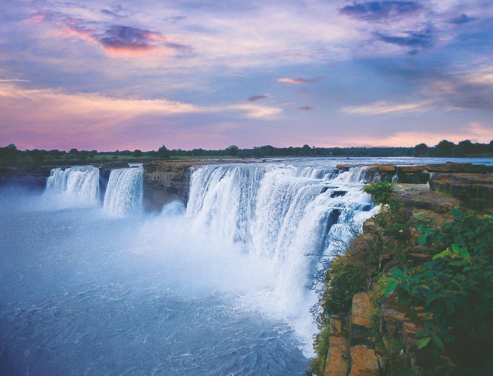 Horseshoe-shaped Chitrakote Falls on the Indravati River at dusk